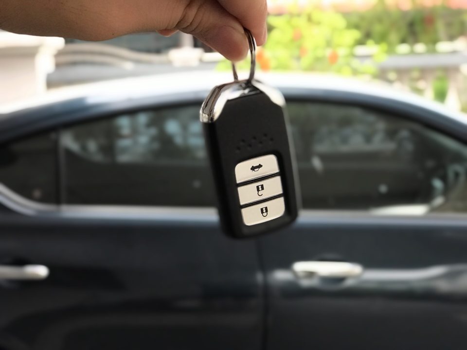 Bought a new car. A man holding car key